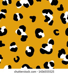 Simple leopard pattern. Orange background, white black spots,animal skin leopard. Print is well suited for textiles,packaging,Wallpaper, banner.