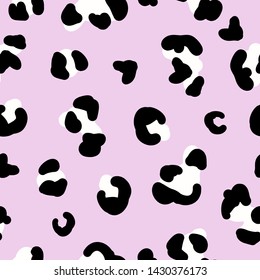 A simple leopard pattern. Trend. Pink background, black and white leopard spots. Print is well suited for Wallpaper,textiles ,packaging.