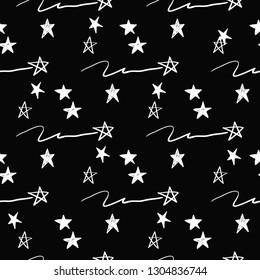 Simple little stars. Hand drawn white line seamless pattern on black background. Doodle brush, pen, marker illustration. Scribble ornament background.