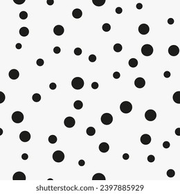 Simple minimalistic seamless pattern, black hand-drawn dots of different sizes on a white background. Sugar sprinkles, confetti.