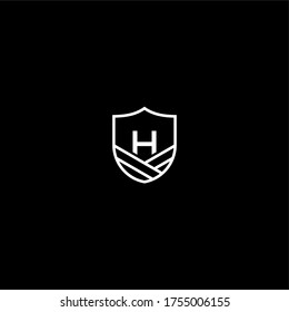 Simple modern badge H logotype design concept isolated with black background.