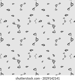 A simple pattern of abstract geometric shapes on a gray background.