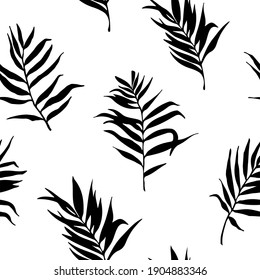 A simple pattern of black tropical leaves. The silhouettes of the branches of palm trees. Flat vector illustration.