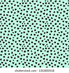 A simple pattern of hearts. Bright green background,small black hearts. Print is well suited for textiles,banners,packaging,postcards.