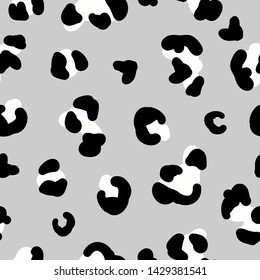 A simple pattern of leopard spots. Gray background, black and white spots coloring leopard trend. The print is well suited for textiles,Wallpaper and banners.