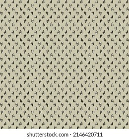 Simple pattern on the gray surface, made of tiny crosses and marks drawn in black. Textile design.