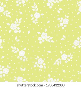A simple pattern with vintage flowers. Yellow background, white ornament flowers, dots. The print is well suited for textiles and packaging.