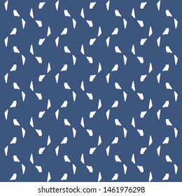 Simple pattern with white shards arranged on a zigzag path. Blue decorative background. Tile. Textile. Paper. Vector illustration.