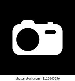 Simple photo camera. Technology icon. White icon on black background. Inversion