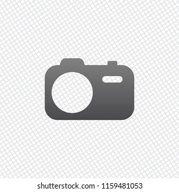 Simple photo camera. Technology icon. On grid background