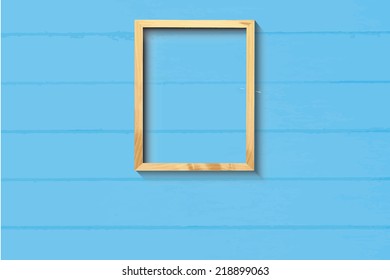 Simple picture frame on light blue wood background, EPS vector
