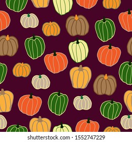 Simple pumpkin pattern. Burgundy background, cute colored pumpkins . The print is well suited for textiles, banner, Wallpaper and packaging.