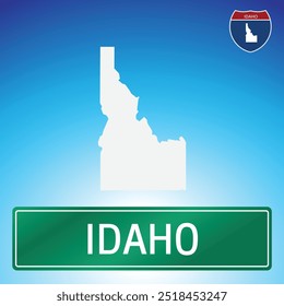 Uma simples placa de estrada para Idaho com um mapa do estado ao fundo. O sinal é verde com letras brancas, e o mapa é branco com um fundo de gradiente azul.