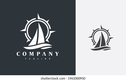 simple sailboat and compass logo	