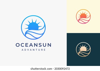 Simple sea or surf logo with ocean wave and sun in circle shape