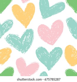 Simple seamless background with hearts in pastel colors.