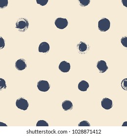 Simple seamless background in polka dots. Hand drawn.
