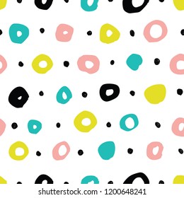 Simple seamless background in polka dots. Hand drawn.