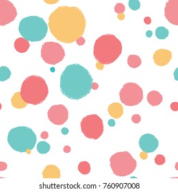 Simple seamless background in polka dots. Vector pattern in pastel colors.
