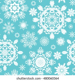 Simple seamless blue christmas pattern with mandala snowflakes, vector background
