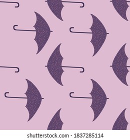 Simple seamless doodle season pattern with umbrella silhouettes. Rainy protection accessory print in purple and lilac tones. Designed for fabric design, textile, wrapping, cover. Vector illustration