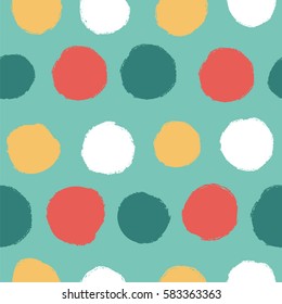 Simple seamless pattern on turquoise background with polka dots.