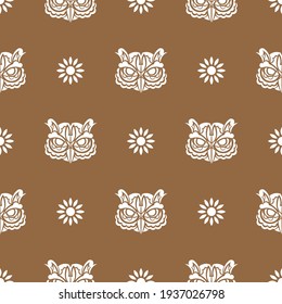 Simple seamless pattern owl face in boho style. Good for clothing and textiles. Vector illustration.