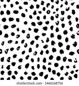 Simple seamless pattern in polka dot style. Black and white print for textiles. Brush strokes drawn in ink by hand. Vector illustration.