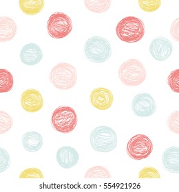 Simple seamless pattern with polka dots in pastel colors.