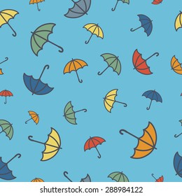 Simple seamless pattern with umbrellas in pastel colours
