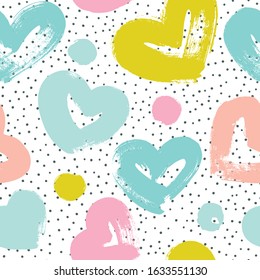 Simple seamless patterns with hearts and polka dots. Vector background in pastel colors.