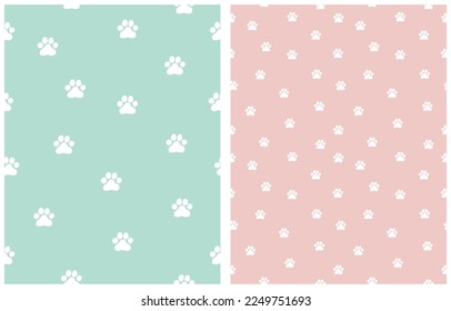 Simple Seamless Vector Patterns with Cat Paws Tracks on a Pastel Blue and Light Pink Background. Simple Little Kitten Paws Print ideal for Fabric, Textile, Wrapping Paper, Cat Lovers.