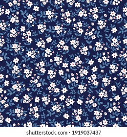 simple seamless vintage pattern. dark blue background. small white flowers. print for wallpaper and textiles.