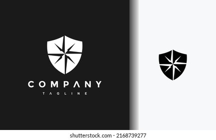 logotipo negro de brújula de escudo simple