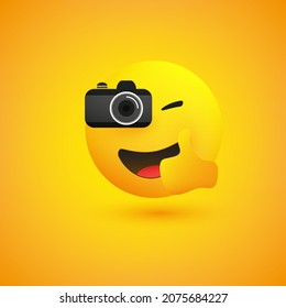 Simple Shiny Happy Smiling Photographer Emoji Taking Picture with a Digital Camera and Showing Thumbs Up - Emoticon on Yellow Background