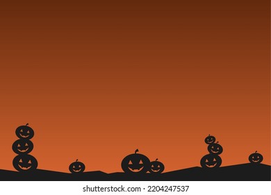 simple silhouette background with several stacked pumpkins and orange sky for halloween