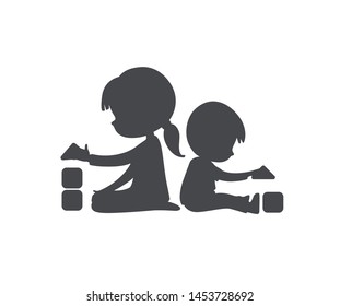 Simple Silhouette of Boy and Girl playing with toy blocks. Can be used as logo or sign. Vector Black and white illustration. isolated.