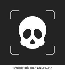 Simple skull icon. White object in camera autofocus on dark background