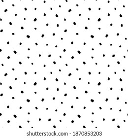 Simple and small black dots seamless pattern. Random scattered blots, abstract black and white background. Freehand drawing vector polka dots. Print, wrapping paper, wallpaper, textile design.