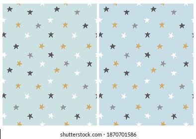 Simple Starry Seamless Vector Patterns Set. Black, White and Gold Hand Drawn Stars Isolated on a Pastel Blue and Mint Green Background. Nursery Fabric. Starry Night Print.