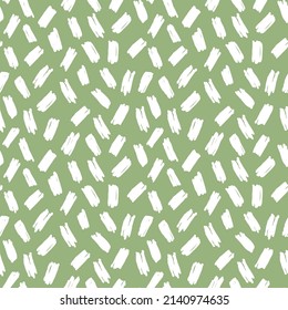 Simple stylish vector pattern with white brush strokes on a green background. Basic background in doodle style. Trendy stylish pattern for fashionable fabrics, wrapping paper, textures