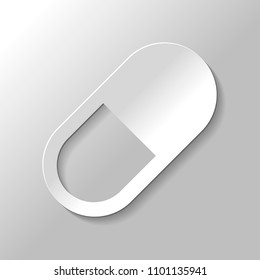 simple symbol of pill or vitamin. Paper style with shadow on gray background