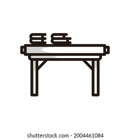 Simple symbol of a study desk, in black line art style and shadow details.