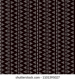 Simple traditional african mudcloth fabric, doted triangles seamless pattern, vector