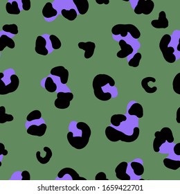 Simple trend pattern. Green background, black and purple leopard spots. The print is well suited for textiles.