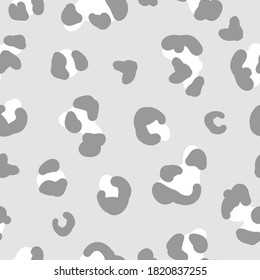 Simple trend pattern. Grey and white leopard spots on a light grey background. Vector texture. Elegant print for Wallpaper.
