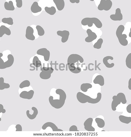 Simple trend pattern. Grey and white leopard spots on a light grey background. Vector texture. Elegant print for Wallpaper.
