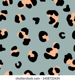 Simple trend pattern of leopard. Gray blue background, black orange spots. The print is well suited for textiles, banners and Wallpapers.