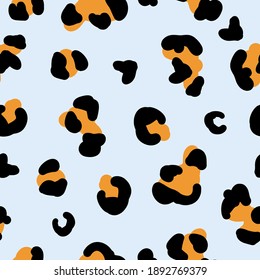 simple trend pattern. Leopard spots on a pale blue background. Fashionable print for wallpaper and textiles.