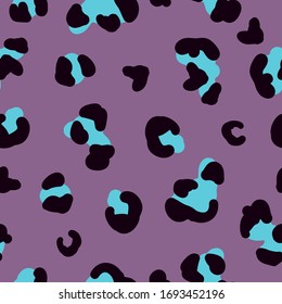 Simple trend pattern. Lilac background, black and blue leopard spots. The print is well suited for textiles, banners, packaging and Wallpaper.